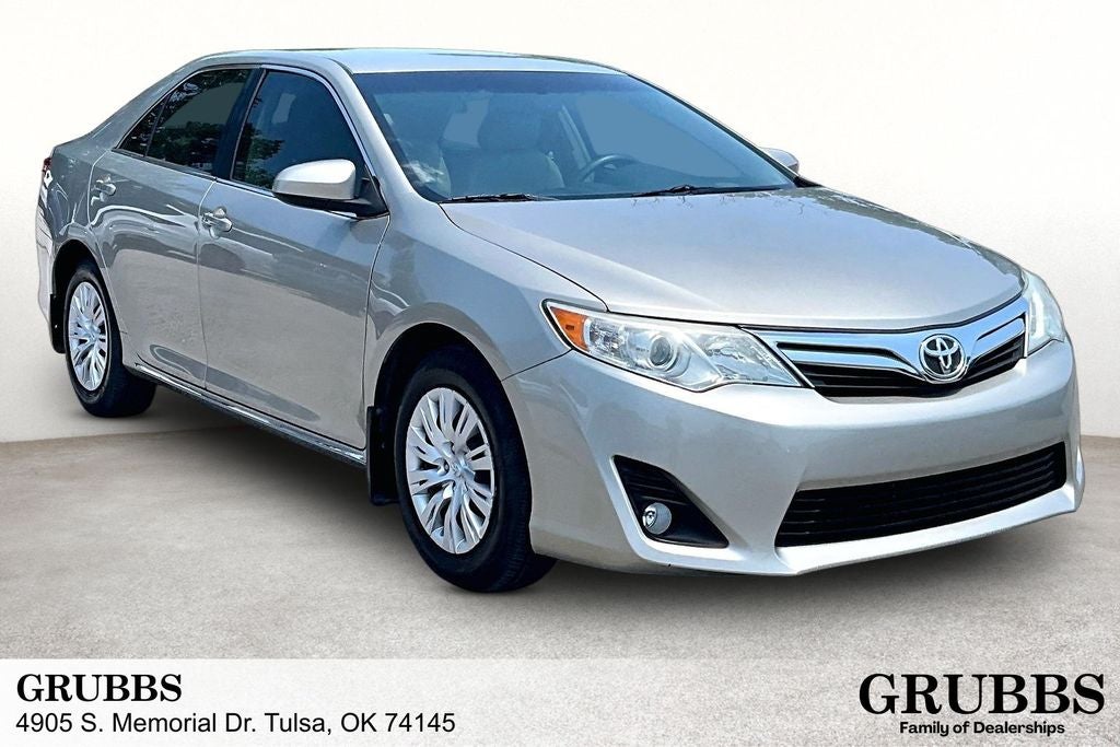 2014 Toyota Camry LE in Creme Brulee — front three-quarter view